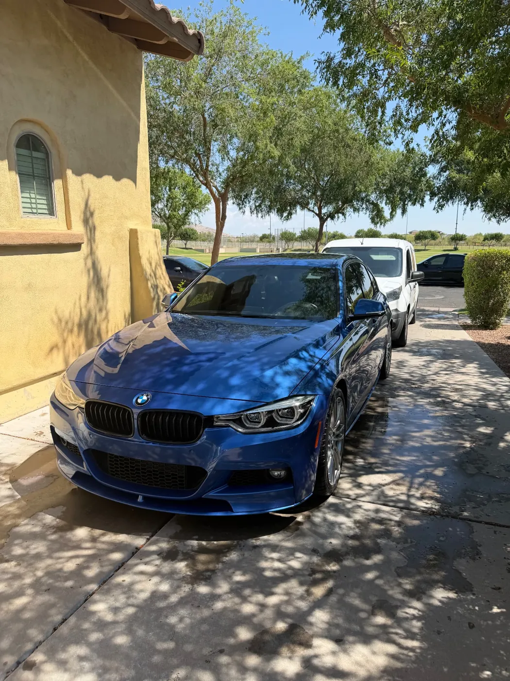 Blue BMW 3 Series M Sport with a deep gloss finish after mobile detailing at a Surprise, Arizona home